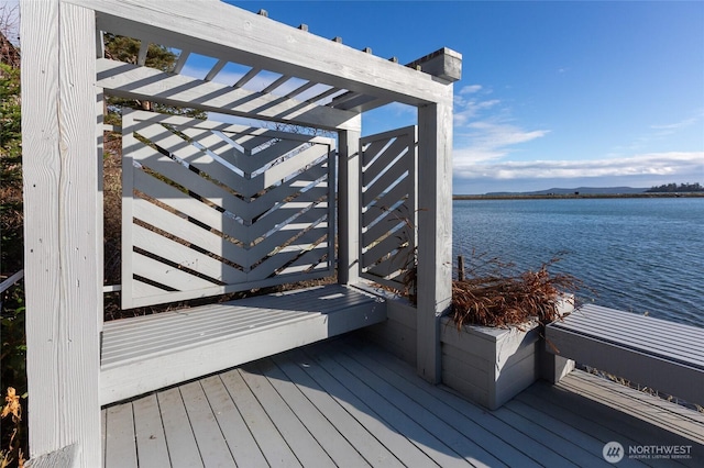 wooden deck with a water view