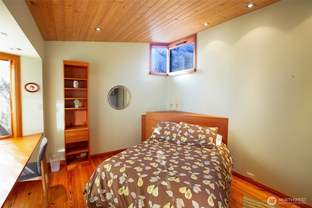 bedroom with wooden ceiling, baseboards, wood finished floors, and recessed lighting