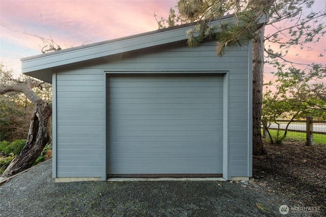 garage with fence