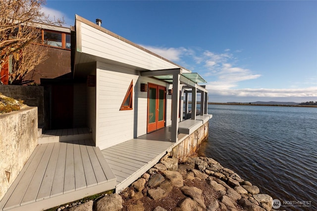 view of side of home with a water view