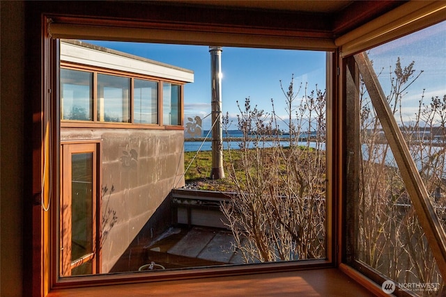 details featuring tasteful backsplash and a water view