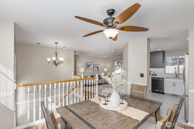 dining area featuring an inviting chandelier, light tile patterned floors, and recessed lighting