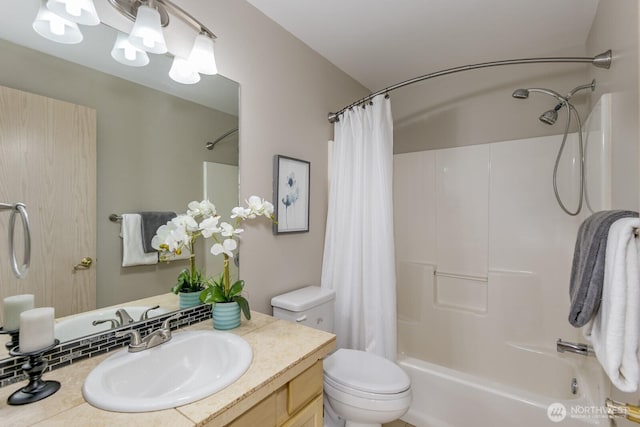 bathroom with toilet, shower / bath combo, and vanity