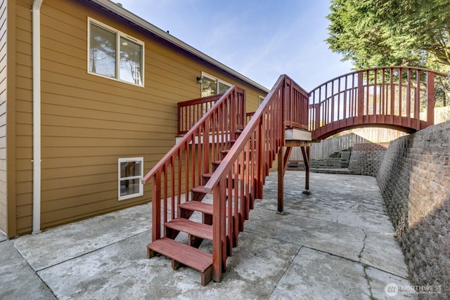 view of patio / terrace featuring stairway