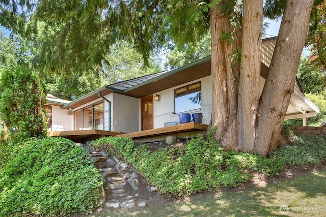 exterior space featuring brick siding