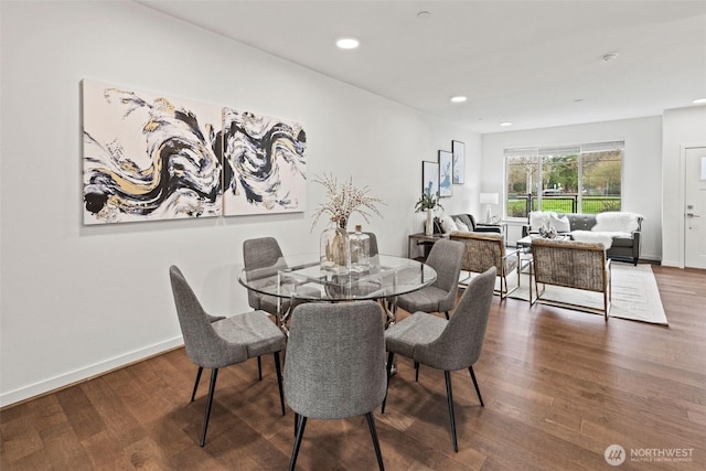 dining space with recessed lighting, baseboards, and wood finished floors