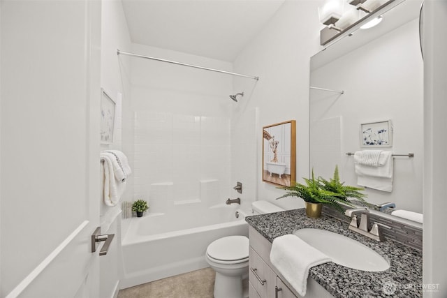 full bath with vanity, tile patterned floors, toilet, and shower / washtub combination