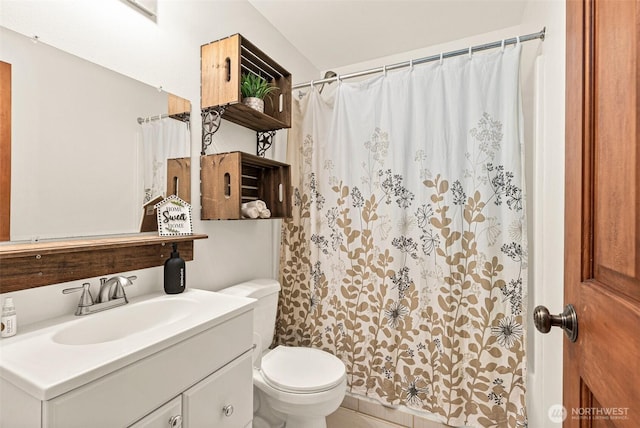 bathroom featuring vanity, toilet, and a shower with curtain