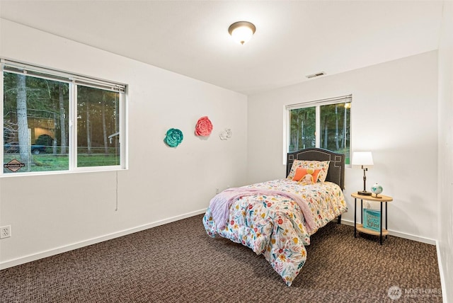 bedroom with baseboards, visible vents, and carpet flooring