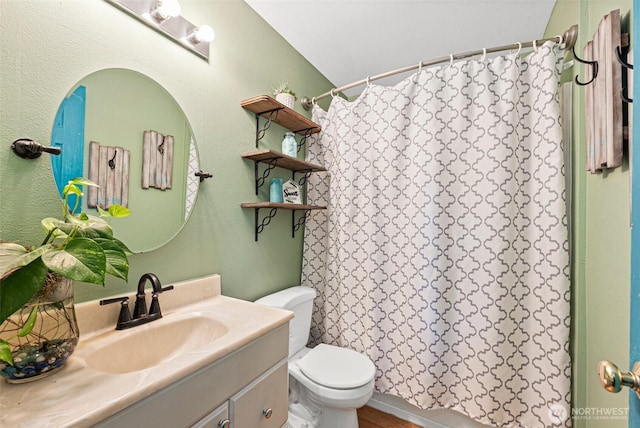 full bathroom with vanity and toilet