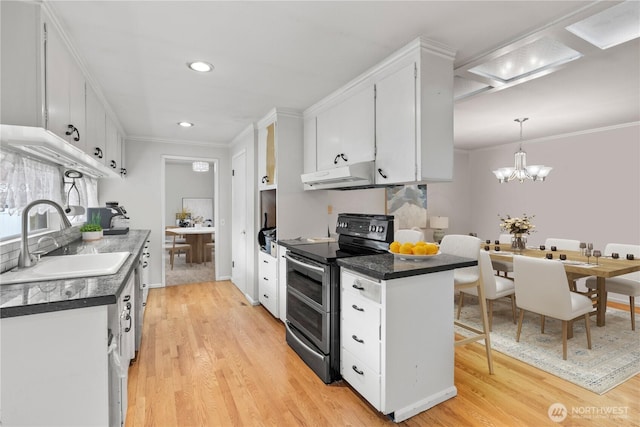 kitchen featuring dark countertops, ornamental molding, a sink, double oven range, and under cabinet range hood