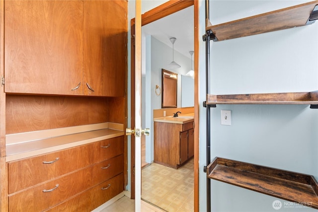 bathroom with vanity and tile patterned floors