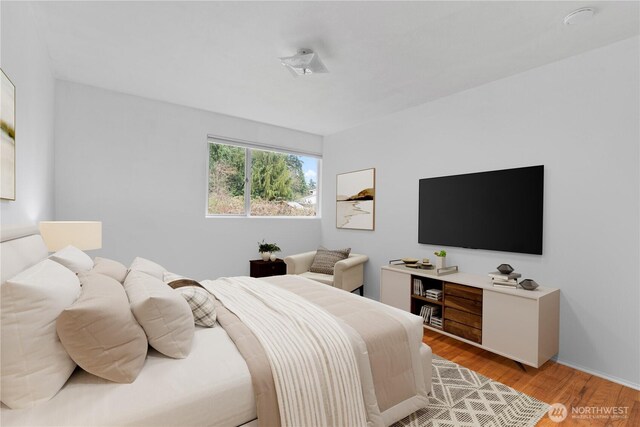 bedroom with light wood-type flooring