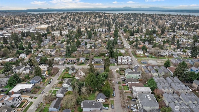 birds eye view of property with a residential view and a water view