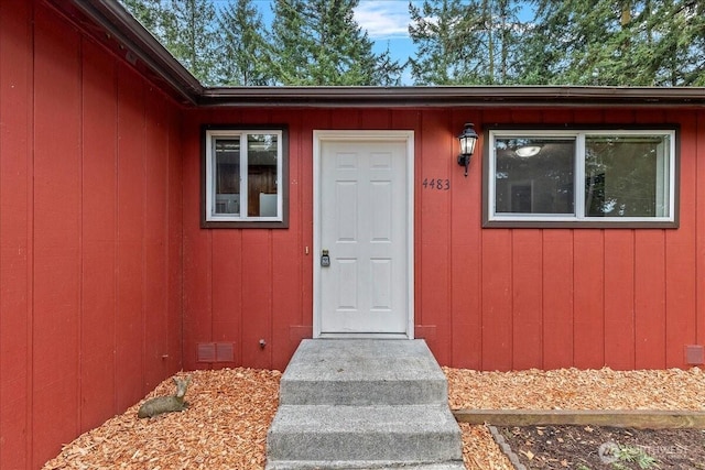 doorway to property featuring crawl space and visible vents