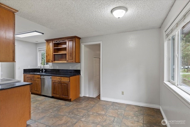 kitchen featuring plenty of natural light, open shelves, stainless steel dishwasher, and dark countertops