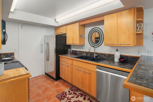 kitchen featuring a sink, light tile patterned floors, stainless steel appliances, a raised ceiling, and open shelves