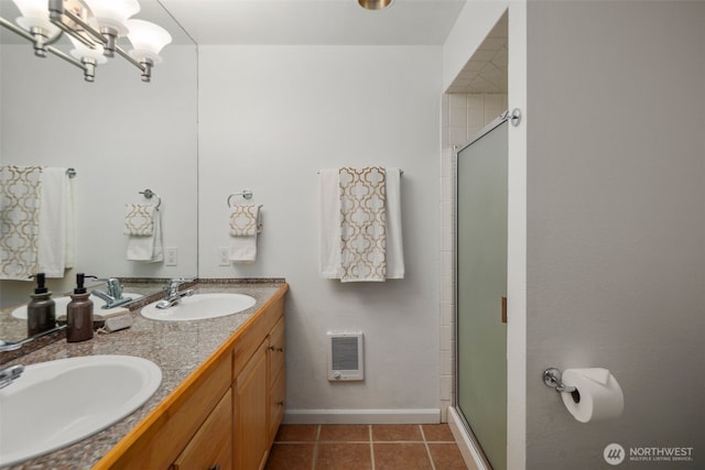 full bath featuring tile patterned floors, a stall shower, visible vents, and a sink