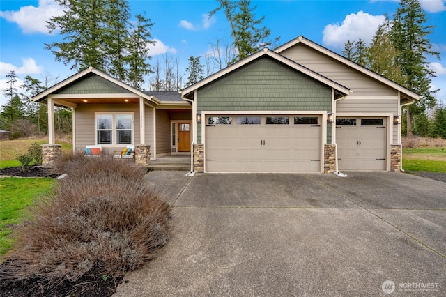 craftsman house featuring stone siding, concrete driveway, and an attached garage