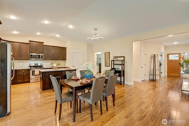 dining area with vaulted ceiling, baseboards, light wood-style flooring, and recessed lighting