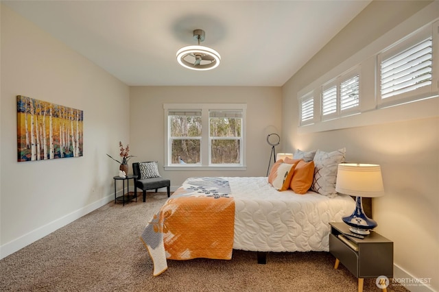 carpeted bedroom with baseboards