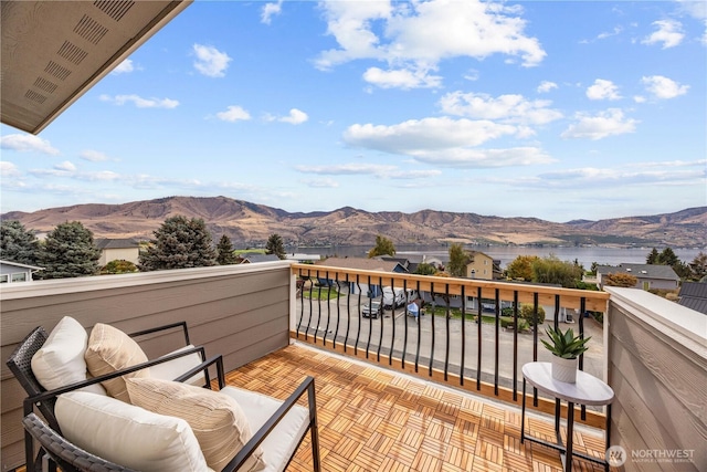 balcony with a water and mountain view