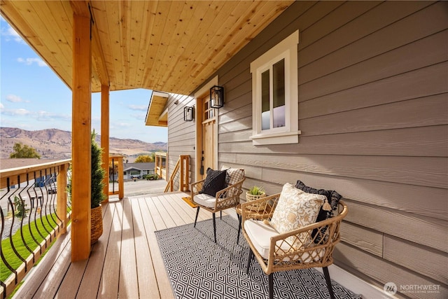 wooden terrace with a mountain view