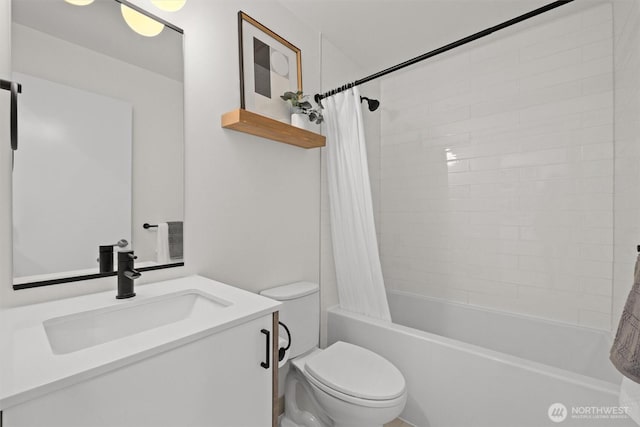 full bathroom featuring shower / bath combination with curtain, vanity, and toilet