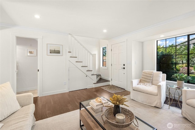 living room with baseboards, stairway, wood finished floors, and recessed lighting