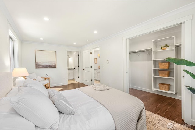 bedroom featuring crown molding, baseboards, and wood finished floors