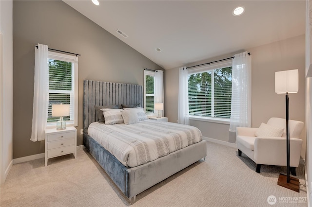 bedroom with visible vents, lofted ceiling, light colored carpet, and baseboards