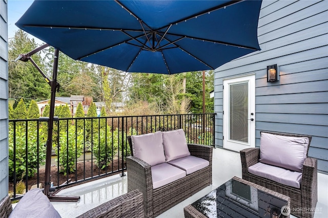 wooden deck with an outdoor living space