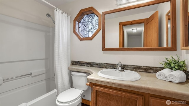 full bath with shower / bathtub combination with curtain, vanity, and toilet