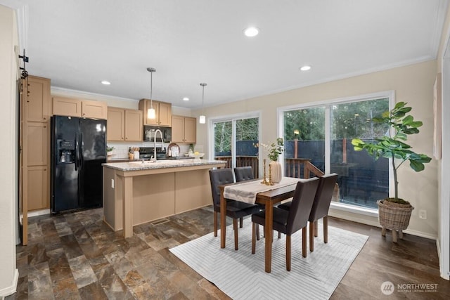 dining room featuring recessed lighting, crown molding, and baseboards