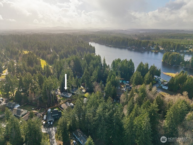 aerial view with a water view and a forest view