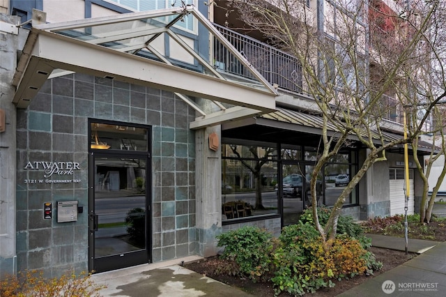 entrance to property with concrete block siding