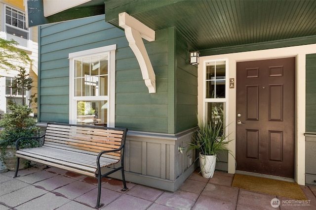 property entrance featuring covered porch