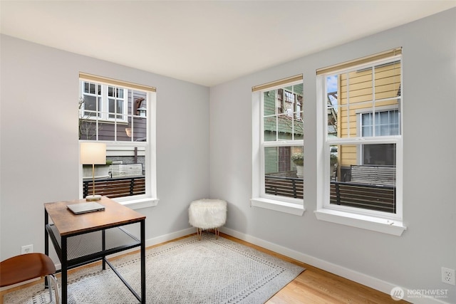 office featuring baseboards and wood finished floors