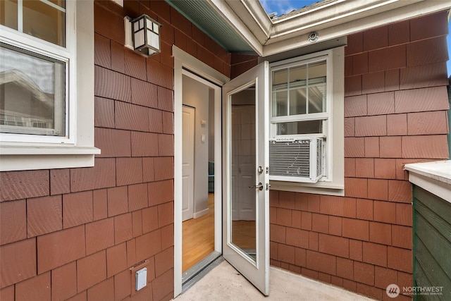 entrance to property featuring cooling unit