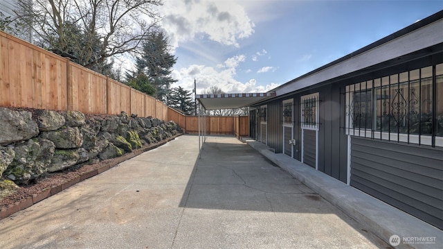 exterior space with a patio and a fenced backyard