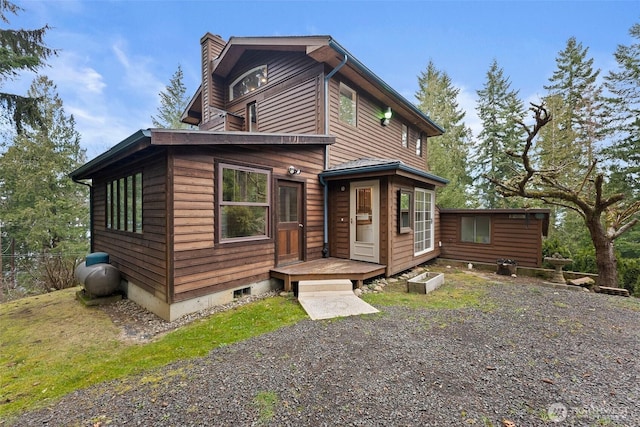 rustic home featuring a chimney