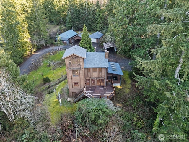 drone / aerial view featuring a view of trees