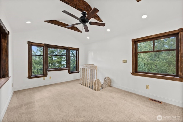 spare room with light colored carpet, visible vents, vaulted ceiling, and recessed lighting