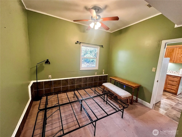 interior space featuring visible vents, crown molding, baseboards, and ceiling fan