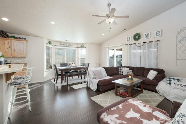 living room featuring recessed lighting, visible vents, vaulted ceiling, and wood finished floors