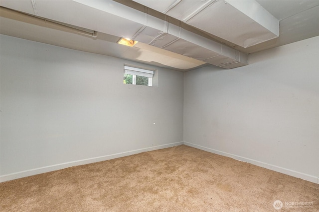 basement with baseboards and carpet floors