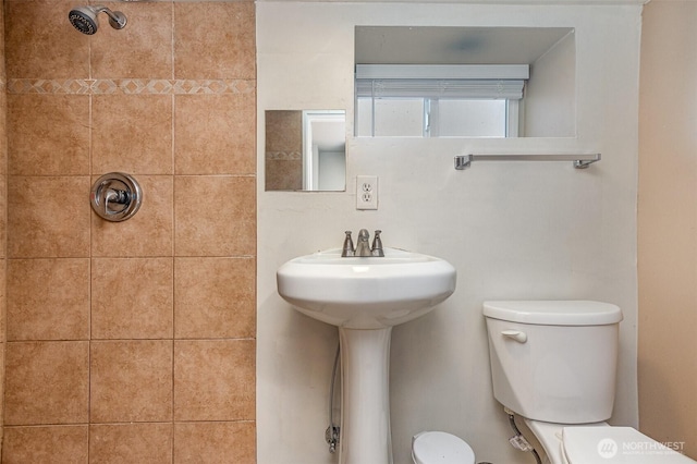 full bathroom with toilet and walk in shower