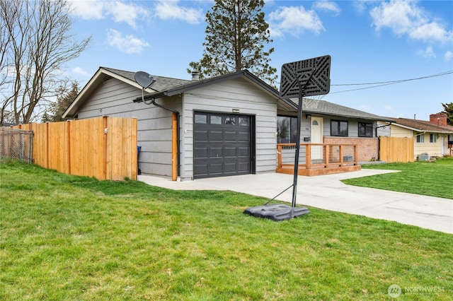 single story home with a garage, concrete driveway, a front lawn, and fence