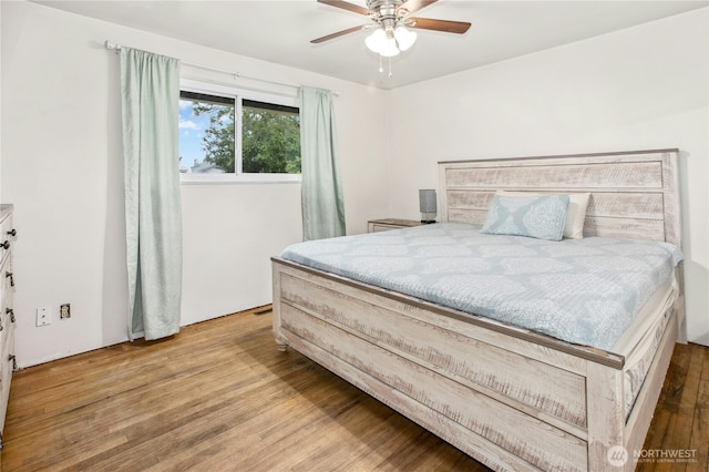 bedroom featuring ceiling fan and wood finished floors