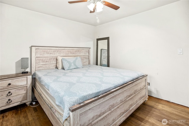 bedroom with a ceiling fan and wood finished floors